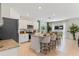 Open-concept kitchen featuring granite countertops, stainless steel appliances, and a center island with seating at 786 Mocking Jay Ln, St Cloud, FL 34771