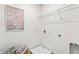 Functional laundry room with shelving, washer/dryer hookups, and ample space at 786 Mocking Jay Ln, St Cloud, FL 34771
