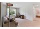 A comfortable living room features a large window, neutral tones, and cozy furnishings at 786 Mocking Jay Ln, St Cloud, FL 34771