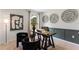 Stylish home office with a contemporary desk, decorative wall art, and comfortable seating at 786 Mocking Jay Ln, St Cloud, FL 34771