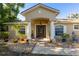 Charming single-story home featuring an intricate rock garden and a covered entryway with columns at 814 Vercelli St, Deltona, FL 32725