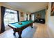 Bright game room with a pool table and natural light at 814 Vercelli St, Deltona, FL 32725