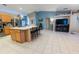 Modern kitchen featuring an island with seating and stainless steel appliances at 814 Vercelli St, Deltona, FL 32725