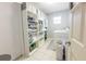 Well-organized laundry room with ample shelving, storage baskets, washer, and dryer at 814 Vercelli St, Deltona, FL 32725