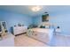 Comfortable main bedroom with tile floors and a serene atmosphere, bathed in natural light at 814 Vercelli St, Deltona, FL 32725