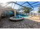 Relaxing screened-in pool area with spa and covered patio, perfect for outdoor entertaining at 814 Vercelli St, Deltona, FL 32725
