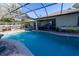 Inviting screened-in pool area, with a pool, spa, and comfortable covered outdoor living space at 814 Vercelli St, Deltona, FL 32725