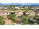 An aerial view showcases a residential neighborhood with well-manicured lawns and tile roofs at 8961 Rhodes St, Kissimmee, FL 34747