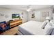 This bedroom has a modern dresser with TV, nautical decor, and a comfortable bed at 8961 Rhodes St, Kissimmee, FL 34747