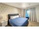 This bedroom has a nice accent wall, ceiling fan, and sliding glass doors at 8961 Rhodes St, Kissimmee, FL 34747