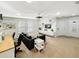 Bright bedroom with an office space, a big grey couch and a large television with built-in shelves at 8961 Rhodes St, Kissimmee, FL 34747