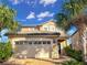 Charming two-story home with well-maintained landscaping and a spacious two car garage at 8961 Rhodes St, Kissimmee, FL 34747