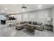 Bright, open living space features tile floors, recessed lighting, and a spacious sectional couch at 8961 Rhodes St, Kissimmee, FL 34747