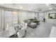 Bright open floor plan features tile floors, a dining area, and a comfortable seating area at 8961 Rhodes St, Kissimmee, FL 34747