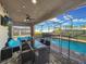 Covered patio featuring contemporary patio furniture and dining under stylish lighting at 8961 Rhodes St, Kissimmee, FL 34747