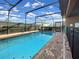 Backyard pool with brick surround and black aluminum pool fence, perfect for summer fun at 8961 Rhodes St, Kissimmee, FL 34747
