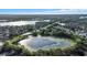 Aerial view of community featuring waterways, homes, and landscaping at 9290 Lake Sharp Ct, Orlando, FL 32817