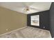 Bedroom featuring neutral carpet, ceiling fan, and a window with a view at 9290 Lake Sharp Ct, Orlando, FL 32817