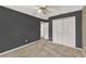 Bedroom featuring neutral carpet, ceiling fan, and a large closet at 9290 Lake Sharp Ct, Orlando, FL 32817