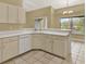 Bright kitchen featuring tile floors and white appliances at 9290 Lake Sharp Ct, Orlando, FL 32817