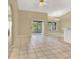 Open-concept living space with sliding glass doors to a screened-in porch at 9290 Lake Sharp Ct, Orlando, FL 32817