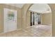Bright living room featuring tile flooring, neutral walls, and large windows with backyard views at 9290 Lake Sharp Ct, Orlando, FL 32817