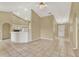 Open living area featuring a bar counter and a view of the entry door at 9290 Lake Sharp Ct, Orlando, FL 32817