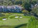 Aerial view of the golf course and townhomes, showing beautiful greenery and well-maintained properties at 9624 Bryanston Dr, Orlando, FL 32827