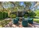 Stunning backyard with outdoor seating area, lush landscaping, and elegant home exterior at 9624 Bryanston Dr, Orlando, FL 32827