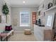 Cozy bedroom features natural light, boho decor, dresser storage, and a comfortable sitting area at 9624 Bryanston Dr, Orlando, FL 32827