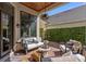Cozy outdoor patio with comfortable seating, perfect for enjoying the beautiful backyard view at 9624 Bryanston Dr, Orlando, FL 32827
