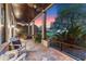 Covered porch with seating, great for outdoor living and enjoying the surrounding landscape at 9624 Bryanston Dr, Orlando, FL 32827