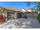 Charming home featuring a two-car garage and decorative wall, showcasing a blend of modern design and curb appeal at 9624 Bryanston Dr, Orlando, FL 32827