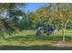 Golf course view with a golfer and golf cart on a sunny day with blue skies at 9624 Bryanston Dr, Orlando, FL 32827