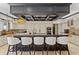 Bright gourmet kitchen features a large island with seating, pendant lighting, and custom cabinetry at 9624 Bryanston Dr, Orlando, FL 32827