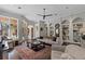 Inviting living room features a large area rug, neutral color palette and backyard access at 9624 Bryanston Dr, Orlando, FL 32827