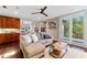 Inviting living room with hardwood floors, lots of natural light and an access door to the balcony at 9624 Bryanston Dr, Orlando, FL 32827