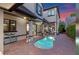 Backyard with a kidney-shaped pool, covered patio, and manicured landscaping at 9624 Bryanston Dr, Orlando, FL 32827