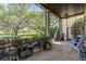Spacious screened-in porch featuring a tile floor and peaceful views of the lush backyard at 9624 Bryanston Dr, Orlando, FL 32827