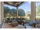 Spacious screened porch with comfortable seating, offering a relaxing outdoor living space at 9624 Bryanston Dr, Orlando, FL 32827