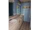 Bathroom with double sinks, vanity, and tile flooring at 9741 Se Highway 464C Se Hwy, Ocklawaha, FL 32179
