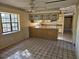Kitchen with ample counter space, cabinets, and adjacent dining area at 9741 Se Highway 464C Se Hwy, Ocklawaha, FL 32179