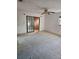 Large living area with sliding glass doors and bright walls at 9741 Se Highway 464C Se Hwy, Ocklawaha, FL 32179