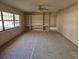 Bright living room with large windows and built-in shelving, offering ample natural light and storage at 9741 Se Highway 464C Se Hwy, Ocklawaha, FL 32179