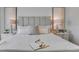 Comfortable bedroom featuring a large bed, stylish headboard, side tables, and decorative lamps for a relaxing retreat at 11148 Amber Ridge Dr, Zellwood, FL 32798