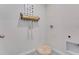 Functional laundry room featuring a dog bed, storage shelf, and bright neutral colors at 11148 Amber Ridge Dr, Zellwood, FL 32798