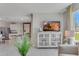 Open-concept living space with a view of kitchen, dining room, and outdoor views at 11148 Amber Ridge Dr, Zellwood, FL 32798