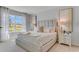 Bright main bedroom features soft carpet, large windows, and luxurious bedding at 11148 Amber Ridge Dr, Zellwood, FL 32798