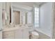 Bright bathroom with a soaking tub, shower, and a single sink vanity with granite countertops at 11763 Eagle Ray Ln, Orlando, FL 32827