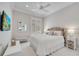 Bedroom featuring a neutral color palette, large windows, and an accent wall at 11763 Eagle Ray Ln, Orlando, FL 32827